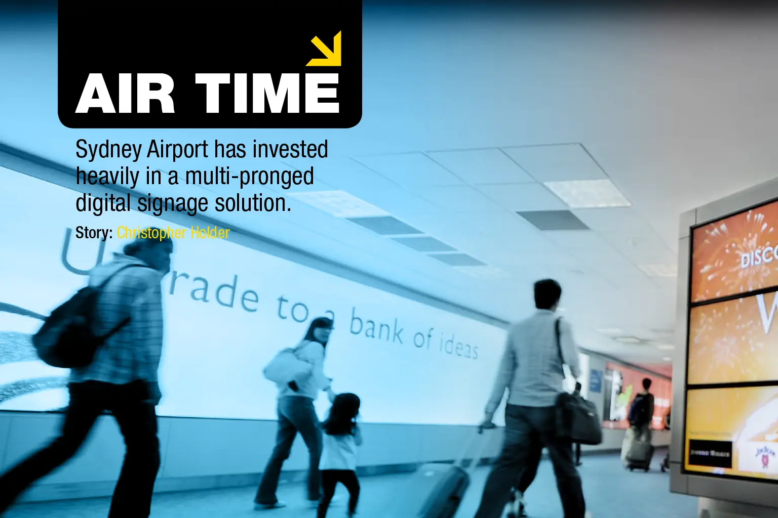 Large-format digital wayfinding and advertising displays inside a modern airport terminal